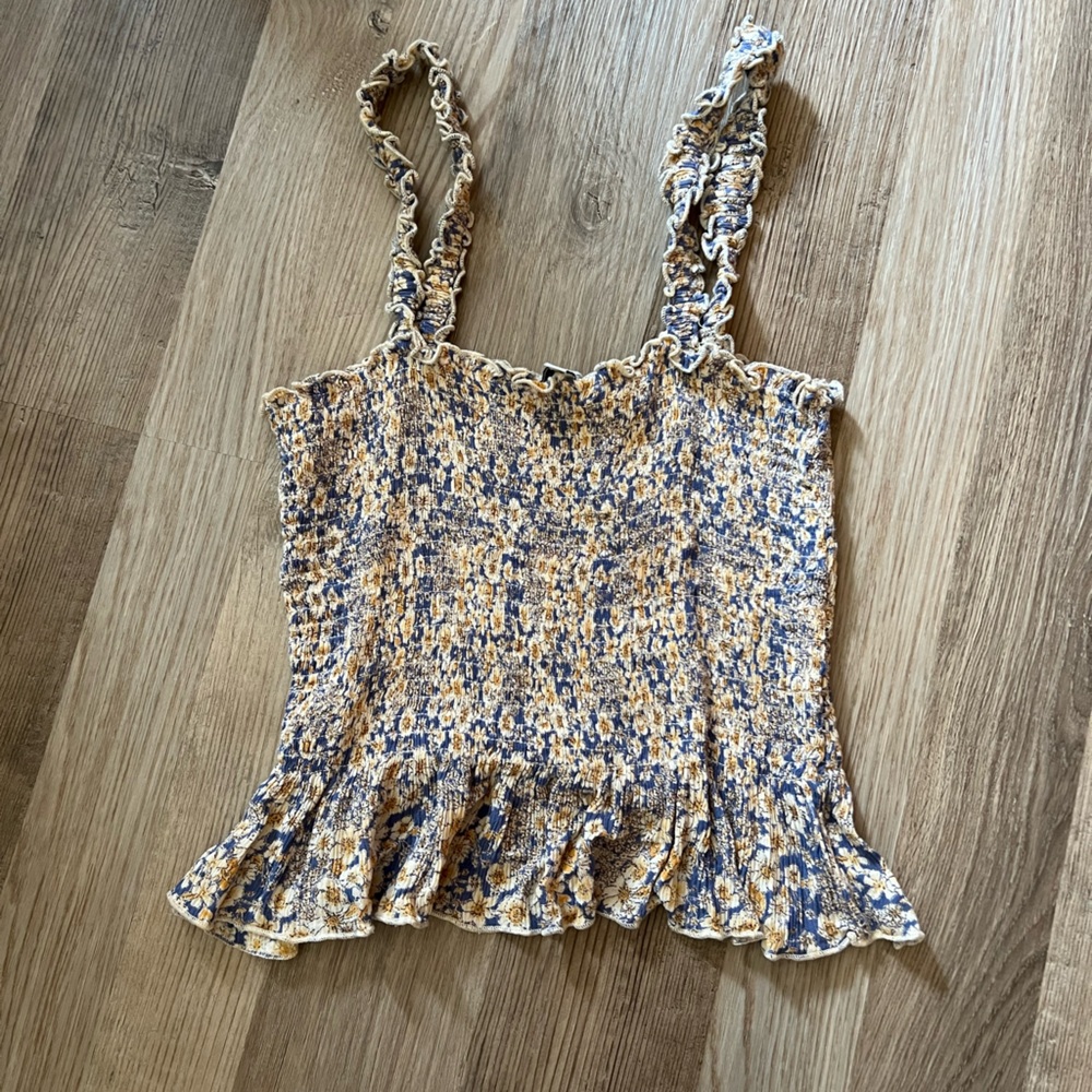 Patrons of peace floral tank blouse with ruffled edges.